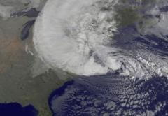 NOAA's GOES-13 satellite captured this visible image of Hurricane Sandy battering the U.S. East coast on Monday, Oct. 29 at 9:10 am EDT. Sandy's center was about 310 miles south-southeast of New York City. Tropical Storm force winds are about 1,000 miles in diameter, and are set to intensify in the 21st century.  Credit: NASA GOES Project