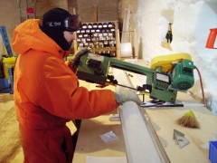 Frédéric Parrenin cutting an ice core into one-meter-long pieces for analysis. Image © Frédéric Parrenin